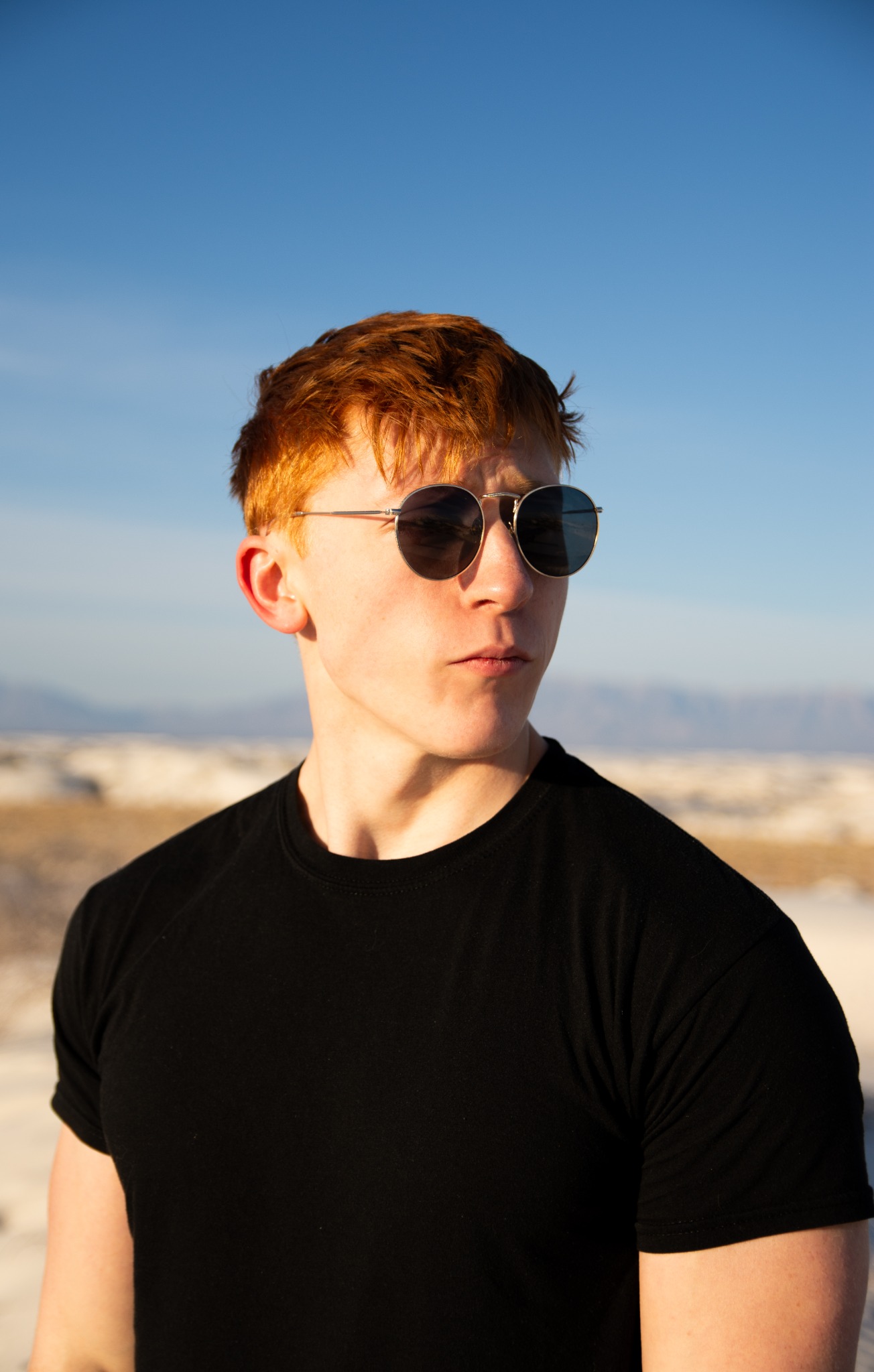 Ben Horch outdoors wearing round sunglasses